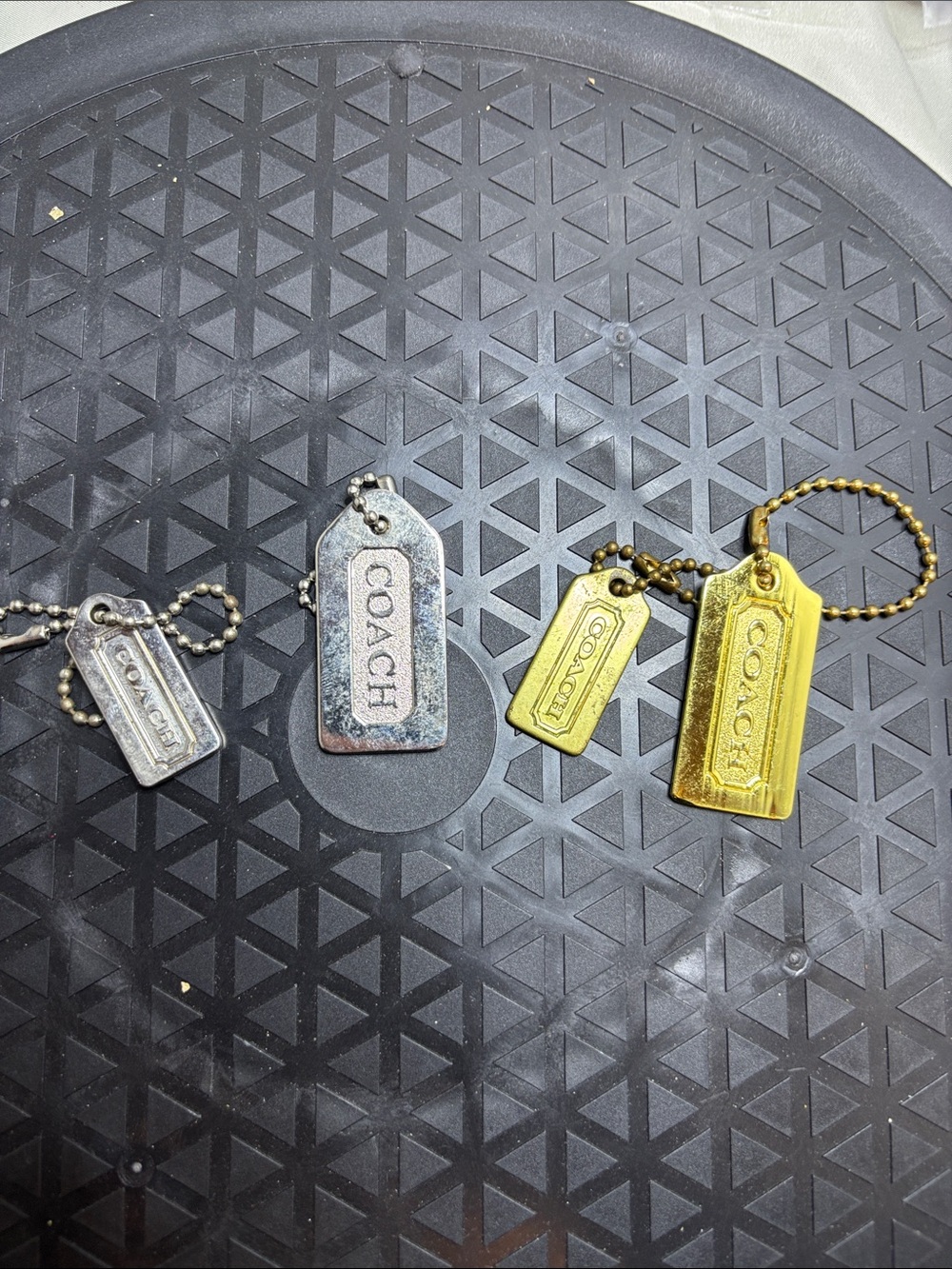 Coach Metal Logo Tag Keychain Pair in Silver and Gold